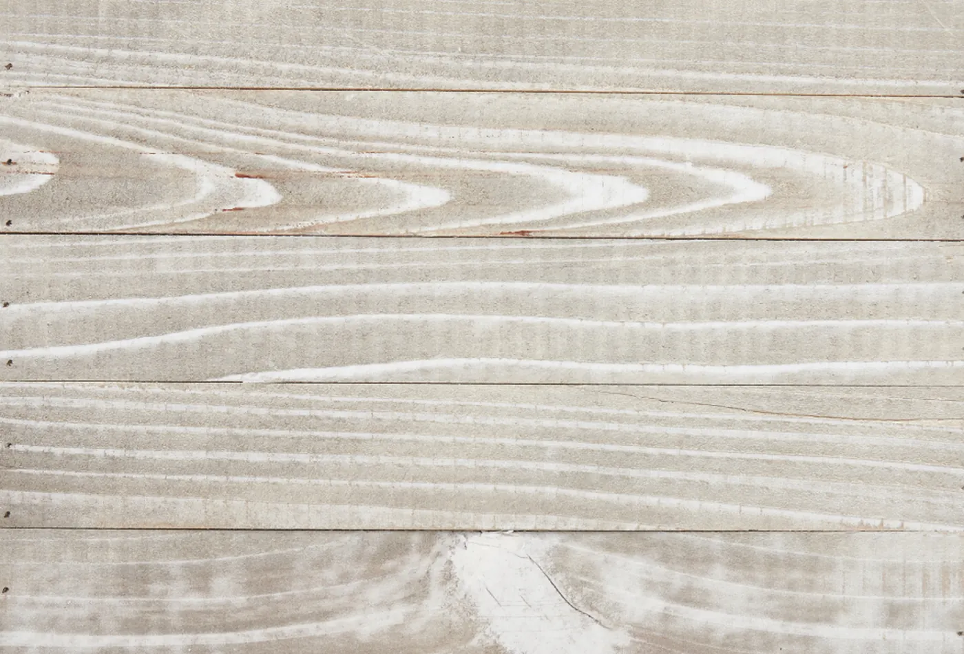 Pale sanded planks with the grain raised and ready for finish